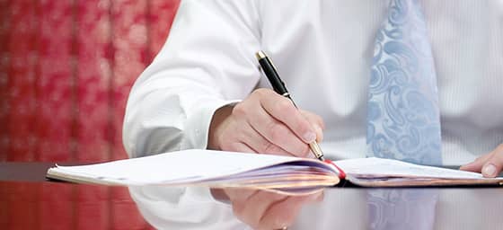 Man writing in a notebook